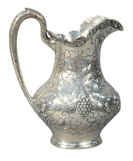 A.G. Schultz Sterling Silver Water Pitcher
having repousse grape, and scrolling leaf design
marked on bottom Sterling, and with Schultz mark
height 10