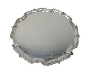 English Silver Salver 
with shaped top on cabriole legs
marked on bottom M & W
height 2 inches, diameter 17 inches
62.4 troy ounces