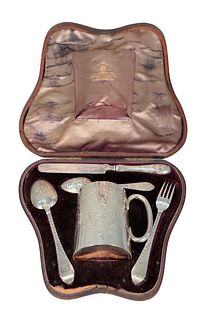 Edward Barnard & Sons Silver Five Piece Travel Set in a fitted box, to include fork, knife, two spoons and mug, all with chased designs and monogramme