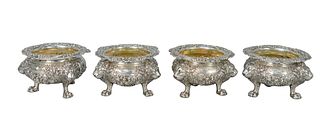 Set of Four Paul Storr Sterling Silver Open Salts
top with scroll and shells on floral repousse bodies with lions, set on claw feet
height 2 /58 inche