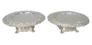 Pair Tiffany & Company Sterling Silver Tazzas
with repousse borders, each set on repousse bases and scrolled feet
height 2 1/4 inches, diameter 6 1/2 