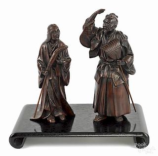 Pair of Japanese patinated bronze figures of a