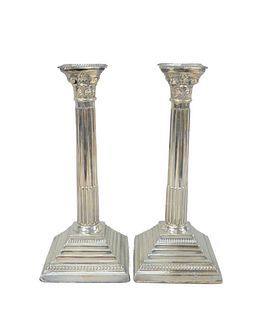 A Pair of English Silver Candlesticks
with stepped square bases
height 12 inches, base 5 inches