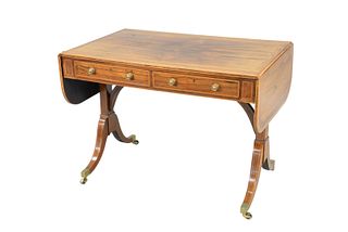 George IV Rosewood Sofa Table
with banded inlaid top and drop leaves, two drawers and two false drawers set on four downswept members, with brass capp