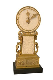 French Dore Bronze Mantle Clockhaving circular dial over rectangle front and back, panel carved in Roman Revival style, with armour, helmets, lions, 