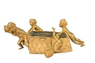 Raoul Francois Larche (1860 - 1912)
French gilt bronze figural table flower basket, depicting children pushing and pulling the basket, inscribed Raoul