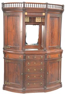 Victorian Walnut Corner Cupboard
in two parts, upper section having spindled top over four tiles, and center mirror
with carved date 1884, flanked by 