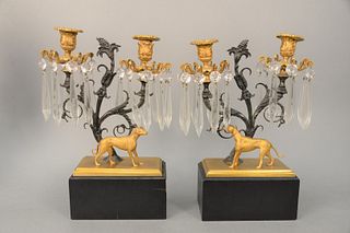 Pair of Regency Dog Candelabra
each having two scrolling arms supporting, two candle holders, with prisms above standing Whippet, on rectangle base
he