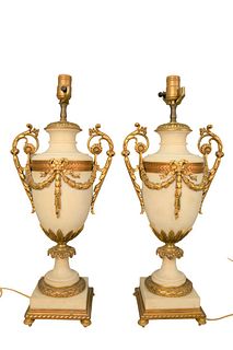 Pair of Large French Marble Urns
having Dore bronze fittings with swags and bands of laurel leaves, on square base, made into table lamps
height 22 1/