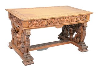 Victorian Walnut Winged Griffin Partners Desk
having oak leaf carved top, in rope edge over two drawers, and two false drawers with carved scrolls, li