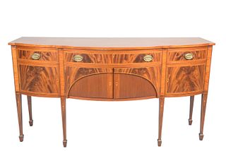 Margolis Mahogany Federal Style Sideboard
having bowed front over three drawers, over four doors, with bell flowers, on square tapered legs having pan