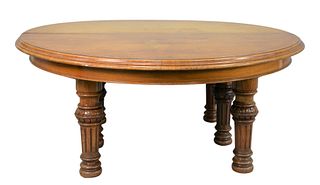 Gillows Round Burled and Figured Walnut Dining Table
with eleven leaves all on turned and fluted legs, with center support legs
opens to 308 inches (2