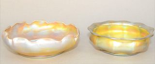Two Louis Comfort Tiffany Favrile Glass Bowls
gold iridescent, having faceted molded body, and ruffled rim
etched L.C.T., 9914 to base (diameter of ba