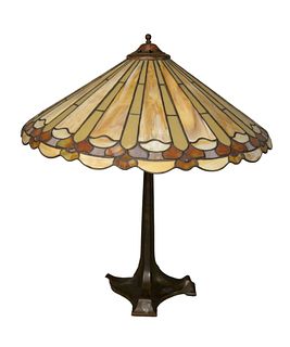 Leaded Shade Table Lamp
having carmel glass shade, on bronze base
height 24 inches, diameter 22 inches
Provenance: Thirty-five year collection of Dana