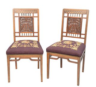 Pair of Aesthetic Rosewood Slipper Chairs
having multi-metal inlays, over carved griffin panel, with brass spindles, and needlepoint seats
seat height