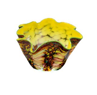 Dale Chihuly (b. 1941)
carnival "Macchia" art glass bowl
having yellow interior, green rim, and multi colored glass exterior
signed and numbered PP04 