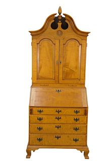 Eldred Wheeler Tiger Maple Secretary Desk 
in two parts, with full bonnet top over two raised panel doors resting on lower section with slant lid, ove