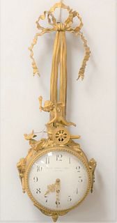 Black Starr and Fronze Bronze Figural Wall Clock
having gilt bronze, ruffled ribbon and bow over Putti figure, on a chariot being pulled by birds, and