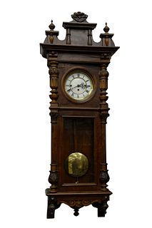 Vienna Regulator Clock
walnut case with enameled face
having triple brass weights
height 49 inches