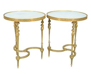 A Pair of Gueridon Tables
having round white marble tops with garland and flower band over figural legs
height 27 1/4 inches, diameter 23 inches