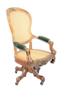 Victorian Walnut Swivel Office Chair
with caned back and seat
height 47 inches
Provenance: Matthes-Theriault Collection, Woodbridge, Connecticut