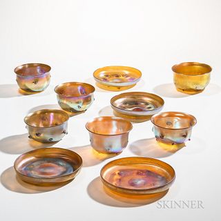 Ten Pieces of Tiffany Studios Gold Favrile Glass, New York, early 20th century, four dishes, six bowls, with various marks, approx. ht.