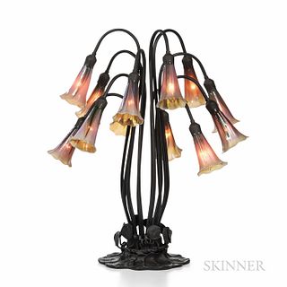 Tiffany-style Water Lily Lamp, mid to late 20th century, bronze and art glass, base with water lily pads and buds, twelve tall "stems"