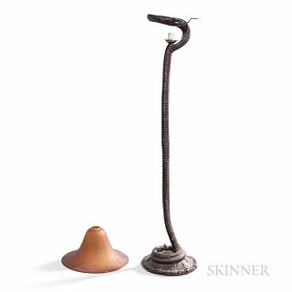 Edgar Brandt La Tentation Reproduction Floor Lamp, late 20th century, head of snake supporting an amber glass shade, ht. 58 1/2 in.