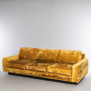 Selig Showcase Sofa, Leominster, Massachusetts, c. 1965, upholstered in gold crushed velvet, wood base and casters, with maker's cloth