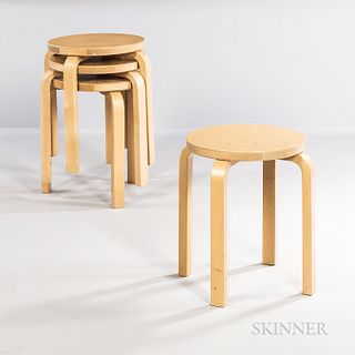 Four Alvar Aalto (Finnish, 1898-1976) for Artek Model E60 Stools, Finland, mid to late 20th century, designed 1945, birch with round to