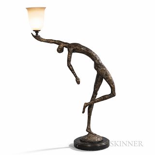 Giacometti-inspired Patinated Metal Figural Floor Lamp, mid-20th century, dancing figure holding an urn-shaped frosted glass shade, unm