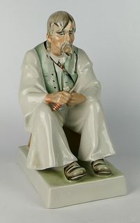 ZSOLNAY PORCELAIN MAN CUTTING BACON, H 13"