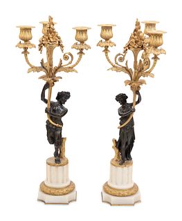 A Pair of Louis XVI Style Parcel Gilt and Bronze Three-Light Figural Candelabra