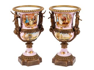 A Pair of Sevres Style Gilt Bronze Mounted Porcelain Urns