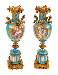 A Pair of Sevres Style Gilt Bronze Mounted Porcelain Urns