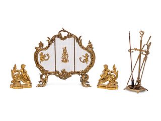 A Louis XV Style Gilt Bronze Four-Piece Fireplace Set