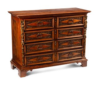 An Italian Baroque Style Walnut Chest of Drawers
