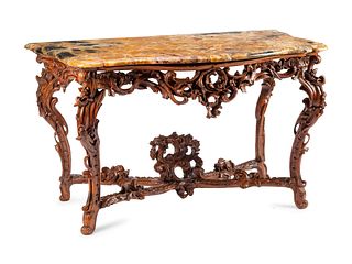 An Italian Rococo Carved Walnut Marble-Top Console Table