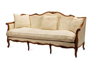 An Italian Carved Walnut Sofa in the Louis XV Taste