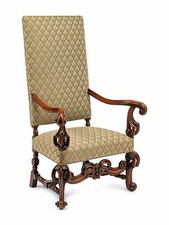 A Continental Baroque Style Carved Walnut Armchair