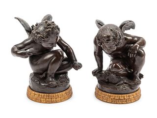 A Pair of Bronzed Terra Cotta Figures on Giltwood Bases