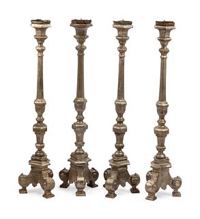 A Set of Four Northern European Gilt and Silvered Wood Candlesticks