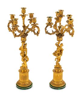 A Pair of Continental Gilt Bronze Figural Five-Light Candelabra with Malachite Veneered Bases