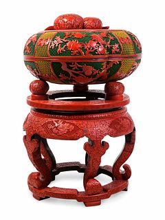 A Set of Chinese Export Carved Red Lacquer "Peach" Nesting Boxes and a Stand