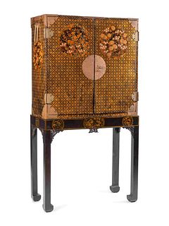 A Japanese Export Lacquer Cabinet on Stand