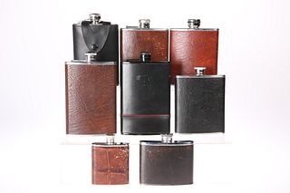 EIGHT VARIOUS HIP FLASKS, all leather covered stainless ste