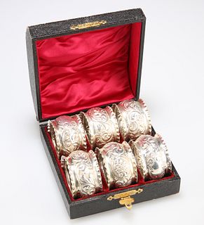 A SET OF SIX LATE VICTORIAN SILVER NAPKIN RINGS, by William