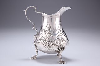 A VICTORIAN SILVER CREAM JUG, by Henry Holland, London 1854
