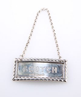 A VICTORIAN SILVER DECANTER LABEL, by Stokes & Ireland Ltd,