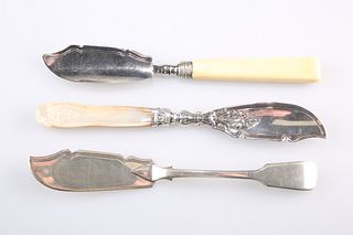 A GROUP OF THREE VICTORIAN SILVER BUTTER KNIVES: the first 